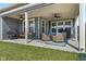 Relaxing covered patio with ceiling fans, comfortable seating, and a grill for outdoor enjoyment at 3121 Arkle Rd, Westfield, IN 46074