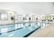 Indoor pool with lane markers, large windows, plants, and seating at 3121 Arkle Rd, Westfield, IN 46074