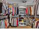 Well-organized walk-in closet with custom shelving, hanging rods, and ample storage space at 3121 Arkle Rd, Westfield, IN 46074
