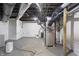 Unfinished basement with exposed pipes, utility box, and concrete flooring at 3345 Ruckle St, Indianapolis, IN 46205