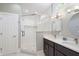 Bathroom boasts a glass-enclosed shower, double vanity with modern fixtures and neutral tiling at 3345 Ruckle St, Indianapolis, IN 46205