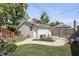 Detached garage with siding, a concrete walkway, and yard with garden beds at 3345 Ruckle St, Indianapolis, IN 46205