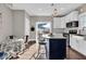 Bright kitchen with white cabinets, a center island, and access to the outdoor patio at 3345 Ruckle St, Indianapolis, IN 46205