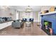 Spacious living room featuring hardwood floors, a fireplace, and comfortable seating at 3345 Ruckle St, Indianapolis, IN 46205