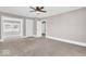 Inviting living room with neutral carpet, light walls, an open doorway, and great natural light, creating a welcoming space at 3345 Ruckle St, Indianapolis, IN 46205
