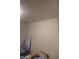 Cozy bedroom featuring neutral walls and a glimpse of personal belongings at 3422 Hillside Ave, Indianapolis, IN 46218