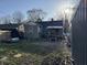 Back exterior of the home with a small, covered back porch, offering outdoor space for relaxation and enjoying the backyard at 3422 Hillside Ave, Indianapolis, IN 46218