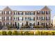 Charming townhomes showcasing a blend of brick and vinyl siding, complemented by neatly landscaped front yards at 3535 Buckner Dr, Westfield, IN 46074