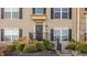 Inviting front porch with a black door, decorative wreath, and well-maintained landscaping at 3535 Buckner Dr, Westfield, IN 46074