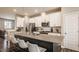Sleek kitchen featuring white cabinets, stainless steel appliances, and a large island with seating at 3535 Buckner Dr, Westfield, IN 46074