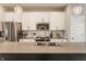 Modern kitchen boasts white cabinets, stainless steel appliances, and a stylish faucet at 3535 Buckner Dr, Westfield, IN 46074