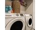 Convenient laundry room with modern, front-load washer and dryer for efficient cleaning at 3535 Buckner Dr, Westfield, IN 46074