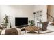Comfortable living room with a large-screen TV, stylish furniture, and modern decor at 3535 Buckner Dr, Westfield, IN 46074