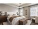 Beautifully appointed main bedroom with tray ceilings and a gorgeous upholstered bed at 3535 Buckner Dr, Westfield, IN 46074