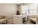 A modern home office boasts a large desk, natural light, and comfortable seating at 3535 Buckner Dr, Westfield, IN 46074