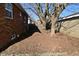 Brick home with side yard with garage in backyard at 3618 Spann Ave, Indianapolis, IN 46203