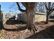 A tree in the backyard offers shade and visual interest to the home's exterior, enhancing its appeal at 3618 Spann Ave, Indianapolis, IN 46203