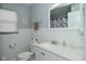 Neat bathroom featuring white beadboard paneling and vanity at 3618 Spann Ave, Indianapolis, IN 46203