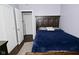 Bedroom featuring hardwood floors, bed, and two doors leading to closets at 3618 Spann Ave, Indianapolis, IN 46203