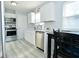 Modern kitchen with white cabinets, stainless steel appliances, and new countertops at 3618 Spann Ave, Indianapolis, IN 46203