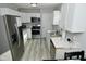 Contemporary kitchen boasting marble countertops and stainless steel appliances at 3618 Spann Ave, Indianapolis, IN 46203