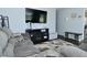 Spacious living area featuring modern entertainment setup and cozy furnishings at 3618 Spann Ave, Indianapolis, IN 46203