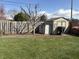Fenced backyard with shed and grassy lawn providing ample space for outdoor activities at 3760 Briar Hill Way, Columbus, IN 47203