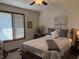 Well-lit bedroom with a decorative bedspread, large window, and comfortable furnishings at 3760 Briar Hill Way, Columbus, IN 47203