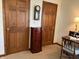 Bedroom featuring wooden dresser, desk, chair, and closet at 3760 Briar Hill Way, Columbus, IN 47203