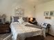 Bright bedroom with decorative quilt, artwork, and classic furniture at 3760 Briar Hill Way, Columbus, IN 47203