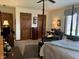 Spacious bedroom with a four-poster bed, classic furnishings, and plenty of natural light at 3760 Briar Hill Way, Columbus, IN 47203