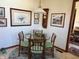 Cozy breakfast nook features a glass-top table, unique chairs, and natural light at 3760 Briar Hill Way, Columbus, IN 47203