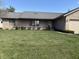 Inviting single-story home with manicured lawn, brick and vinyl siding, and attached garage at 3760 Briar Hill Way, Columbus, IN 47203