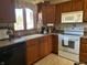 Functional kitchen features solid countertops, modern appliances, and ample cabinetry at 3760 Briar Hill Way, Columbus, IN 47203