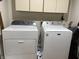 Laundry room with modern Whirlpool washer and Maytag dryer at 3760 Briar Hill Way, Columbus, IN 47203
