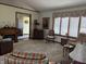 Spacious living room featuring a fireplace, classic furniture, and large windows at 3760 Briar Hill Way, Columbus, IN 47203