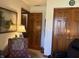Cozy living room with comfortable armchair, warm lighting, and classic decor at 3760 Briar Hill Way, Columbus, IN 47203