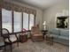 Cozy living room with decorative window treatments, patterned furniture, and a plush rug at 3760 Briar Hill Way, Columbus, IN 47203