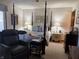 Serene bedroom with four poster bed, side tables, and plush carpeting at 3760 Briar Hill Way, Columbus, IN 47203