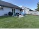 Backyard patio features outdoor seating and grilling, perfect for gatherings at 3760 Briar Hill Way, Columbus, IN 47203
