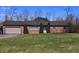 Charming brick ranch home with a large front yard and attached garage at 3922 Dundee Dr, Indianapolis, IN 46237