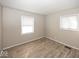 Bedroom showcasing natural light and wood-look flooring at 4008 N Mitthoefer Rd, Indianapolis, IN 46235