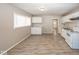 Open concept kitchen featuring white appliances and marble-look countertops at 4008 N Mitthoefer Rd, Indianapolis, IN 46235