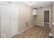 Laundry room showcasing a closet and wood-look floors at 4008 N Mitthoefer Rd, Indianapolis, IN 46235
