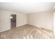Bright living room with modern flooring, neutral walls, and ample natural light at 4008 N Mitthoefer Rd, Indianapolis, IN 46235