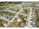 A birds-eye view of the neighborhood highlighting the layout of homes, streets, and vacant lots at 4241 Risen Star Way, Bargersville, IN 46106