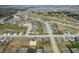 An aerial view showcasing a new neighborhood's layout, including homes, roads, and green spaces at 4241 Risen Star Way, Bargersville, IN 46106