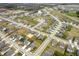 High angle aerial view of a planned community with houses, green spaces, and a pond at 4241 Risen Star Way, Bargersville, IN 46106