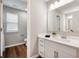 This bathroom features a vanity with drawers, a large mirror, and modern fixtures at 4241 Risen Star Way, Bargersville, IN 46106