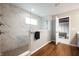 Modern bathroom with a glass enclosed shower featuring marble tile and updated fixtures at 4241 Risen Star Way, Bargersville, IN 46106